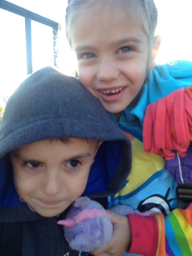 Kayden and Alannah wait for the bus on Wednesday, the day before the deadly Biddeford fire.