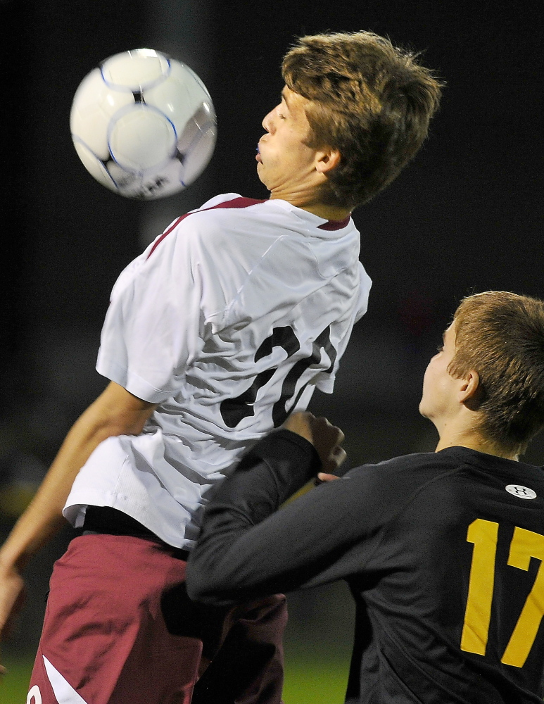 Ben Leverett of Greely chests down a goal kick Tuesday night in front of Matt Concannon of Cape Elizabeth during Greely’s 2-1 victory. The Rangers, the defending Class B state champions, improved their record to 5-0-1.