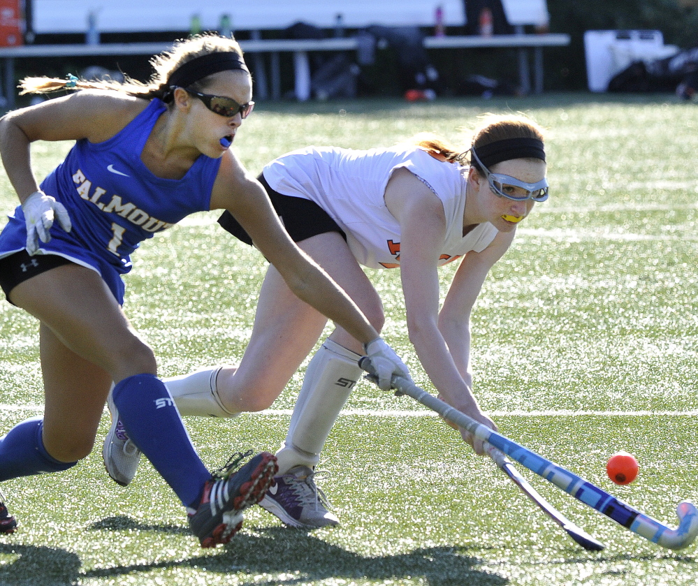 Ellie Fitzgerald of Falmouth, left, attempts to poke the field hockey ball away from Charlotte Eisenberg of North Yarmouth Academy during Falmouth’s 1-0 victory Wednesday.