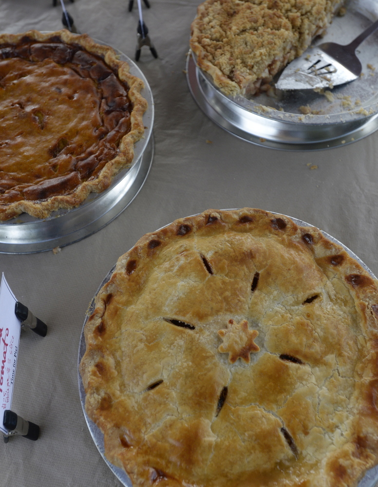 Green Tomato Pie, bottom, and other Pies by Friday Pie Club at the Yarmouth Farmers Market. Shawn Patrick Ouellette/Staff Photographer
