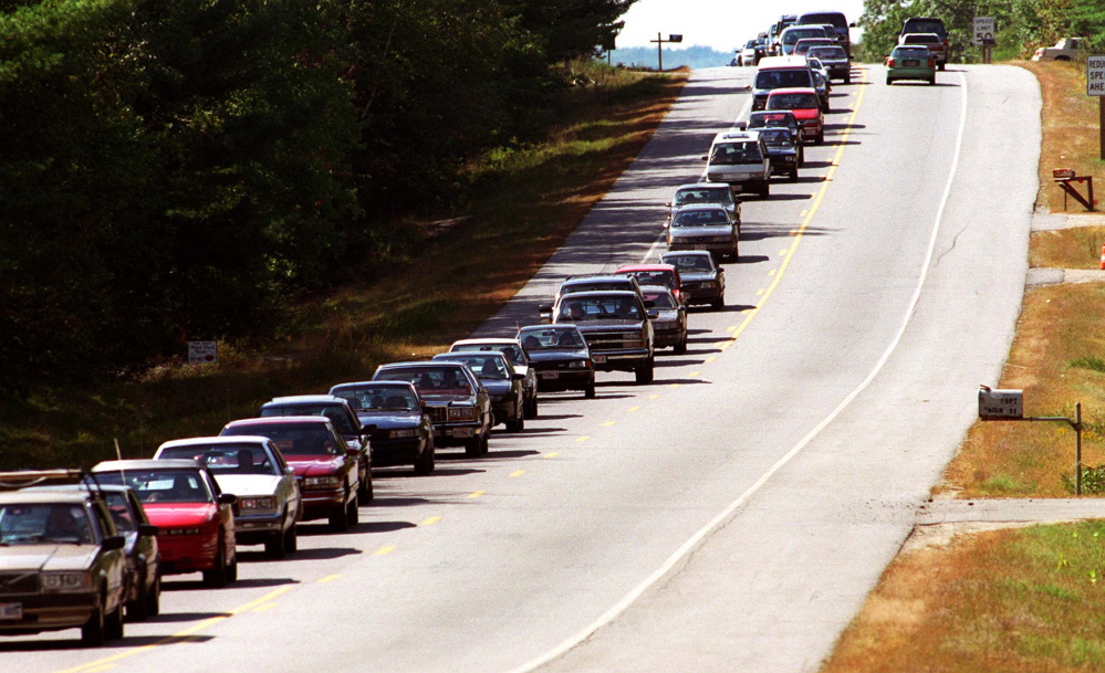 Traffic along Route 17 slows to a stand-still as people attempt to get to the Common Ground Fair in 2001. Things haven’t changed. Cars idled for hours at this year’s gate.