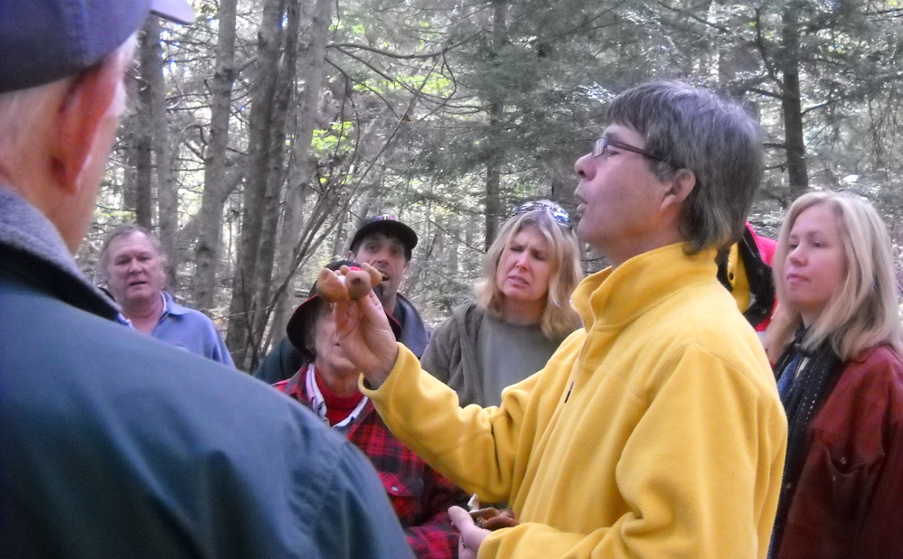 Mycologist  Greg Marley explains how to identify local mushrooms for a group at the Damariscotta River Association. Marley will lead another identification outing on Saturday.