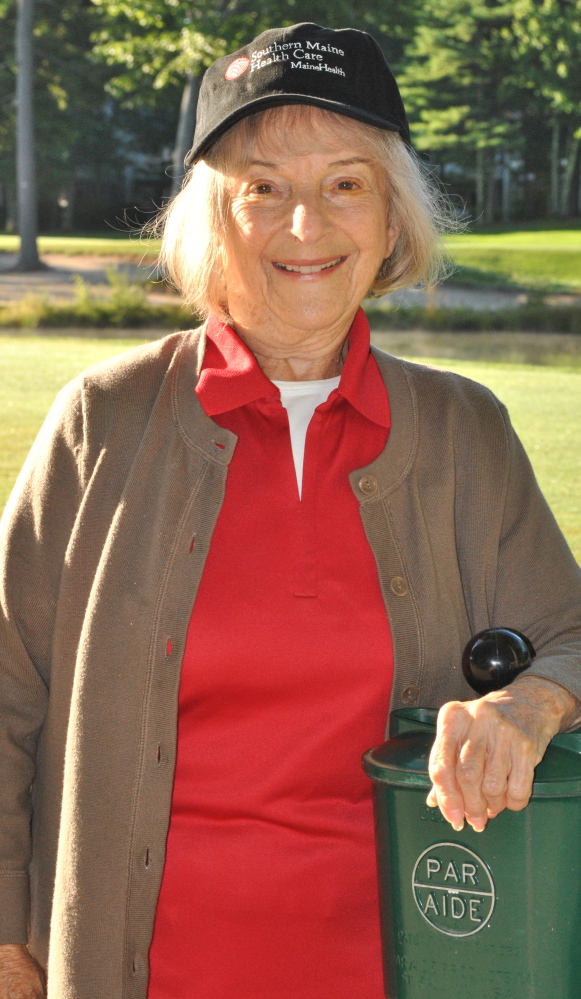 Doris Buonomo, left, a member of the Southern Maine Health Care Auxiliary, is pictured at Dunegrass Country Club in Old Orchard Beach where, for the 15th straight year, she served as a hole-in-one spotter for the Auxiliary’s 20th Annual Golf Tournament. Proceeds from the event support a variety of hospital projects, including  past campaigns to purchase state-of-the-art equipment and renovate rooms for improved patient care and privacy. This year’s tournament raised $23,000 for Pediatric Asthma Program and the hospital’s Cancer Support Program.