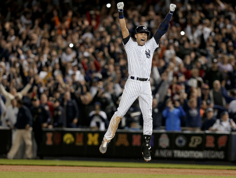 Derek Jeter celebrates his game-winning single in the Yankees’ win Thursday night against the Baltimore Orioles. The game was the last at Yankee Stadium for Jeter, who will retire after this season. He will play his last games this weekend at Fenway Park.