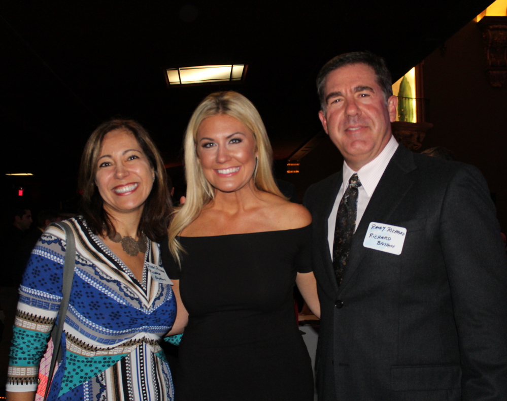 Isabel and Randy Richard of Richard Brothers Financial Advisors flank event host Erin Ovalle, morning anchor of News 8 WMTW, at the Portland Regional Chamber of Commerce 160th anniversary gala on Tuesday at the State Theatre in Portland.