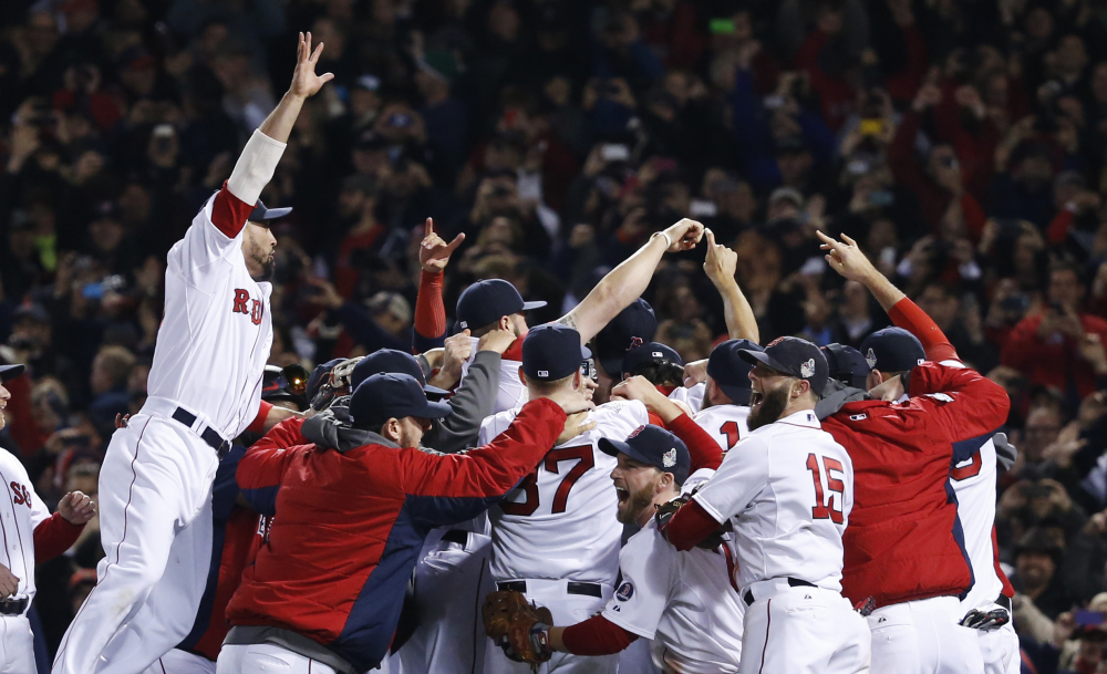 Boston Red Sox players celebrate after defeating the St. Louis Cardinals in Game 6 of baseball's World Series Wednesday, Oct. 30, 2013, in Boston. The Red Sox won 6-1 to win the series. The Associated Press