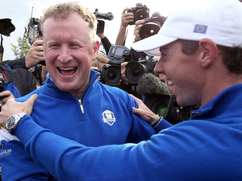 Europe’s Jamie Donaldson, left, and Rory McIlroy celebrate winning the 2014 Ryder Cup golf tournament at Gleneagles, Scotland, on Sunday.