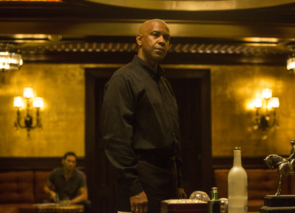 Denzel Washington appears in a scene from the film “The Equalizer.” The film’s estimated $35 million debut is Washington’s third best.
