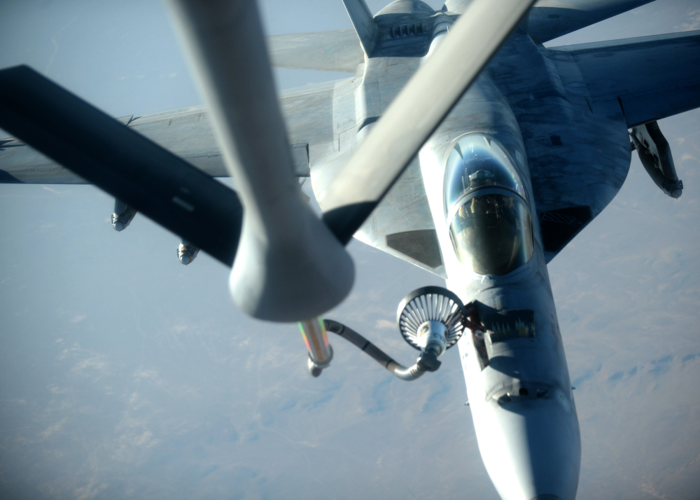 The Associated Press In this Tuesday, Sept. 23, 2014 file photo released by the U.S. Air Force, a U.S. Navy F-18E Super Hornet fighter jet receives fuel from a KC-135 Stratotanker over northern Iraq after conducting airstrikes in Syria as part of U.S.-led coalition airstrikes on the Islamic State group and other targets in Syria.
