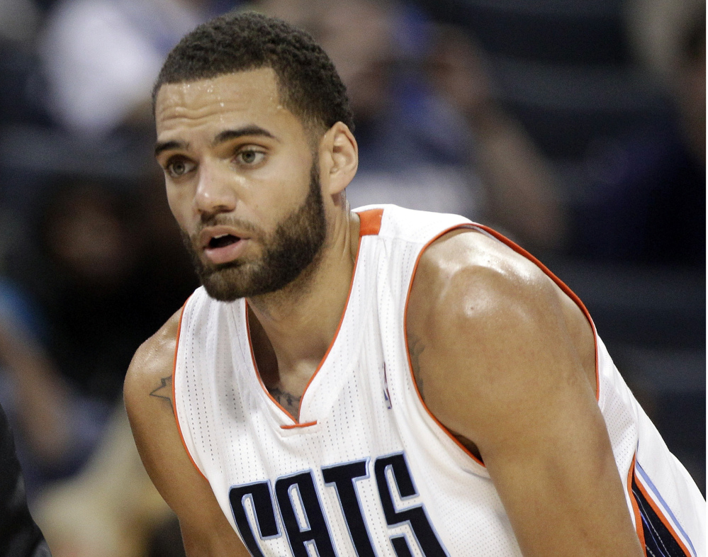 In this Nov. 10, 2012, file hoto, Charlotte Bobcats Jeffery Taylor listens to his coach during the first half of an NBA basketball game against the Dallas Mavericks in Charlotte, N.C.