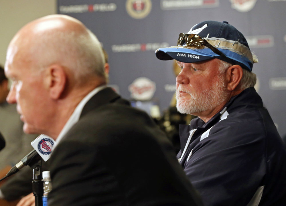 Ron Gardenhire, right, listens as Minnesota Twins general manager Terry Ryan answers a question at a news conference Monday announcing the firing of Gardenhire, who managed the team for 13 seasons.