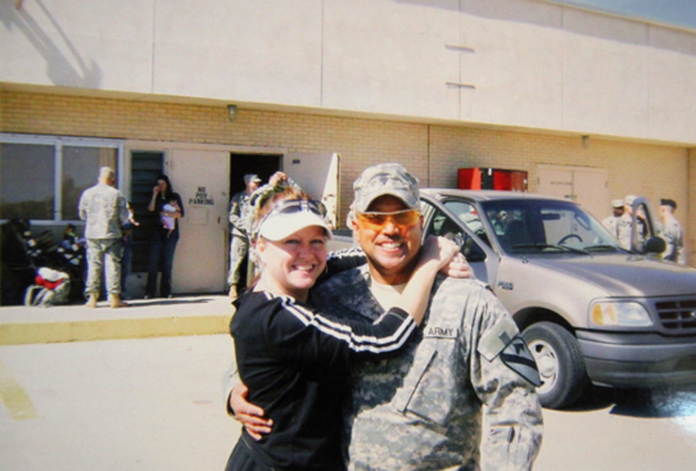 In this undated photo provided by Nancy Hoover, Omar Gonzalez poses for a photo in his Army uniform with his former wife Samantha, prior to an overseas deployment.  something rom story here