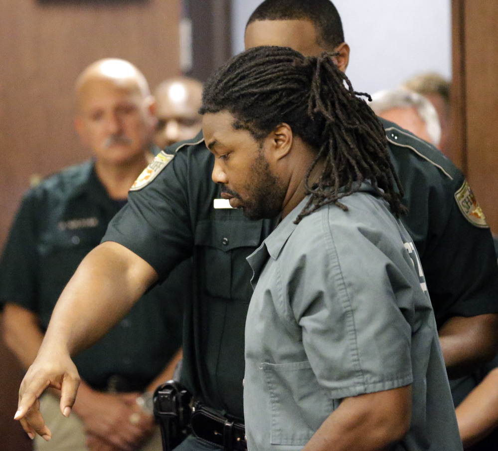 Jesse Leroy Matthew Jr. is escorted into a courtroom in Texas on Thursday, for a hearing to be extradited to Virginia, where he is charged in connection with a missing 18-year-old girl.