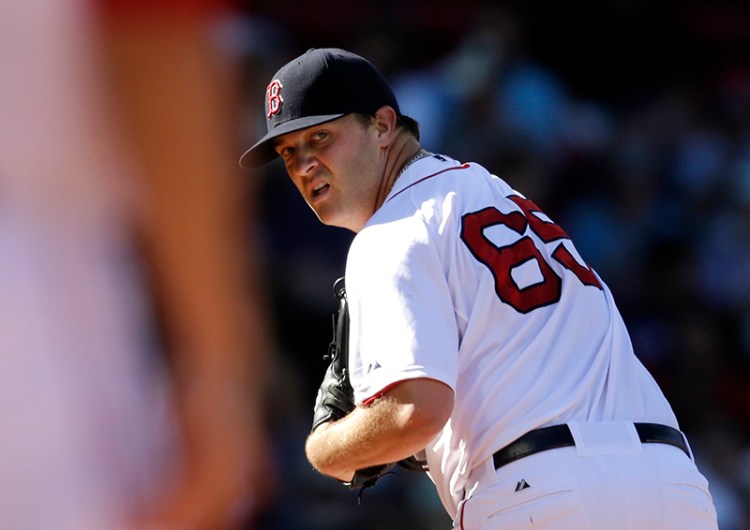 Boston Red Sox relief pitcher Steven Wright looks toward first base in the eighth inning of a baseball game against the Toronto Blue Jays, Sept. 7. The Associated Press