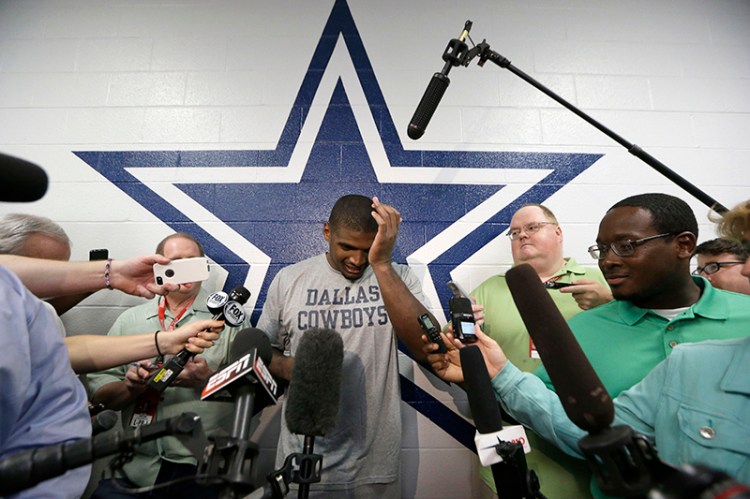 The Dallas Cowboys practice squad's defensive end Michael Sam arrives to speak to reporters after practice at the team's headquarters Sept. 3. 
The Associated Press