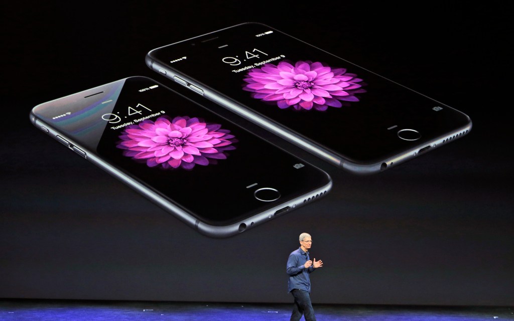 Apple CEO Tim Cook presents the new iPhone 6 and iPhone 6 plus on Tuesday in Cupertino, Calif. The iPhone 6 will have a screen measuring 4.7 inches, while the iPhone 6 Plus will be 5.5 inches. The Associated Press