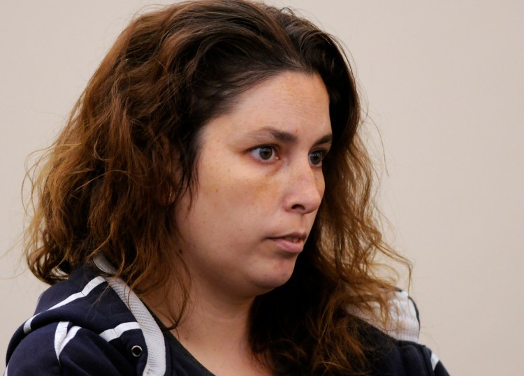 Erika Murray is arraigned at Uxbridge District Court in Uxbridge, Mass., on Friday. Murray, 31, was arrested Thursday night on charges including fetal death concealment, witness intimidation and permitting substantial injury to a child. Not guilty pleas were entered Friday on her behalf.  