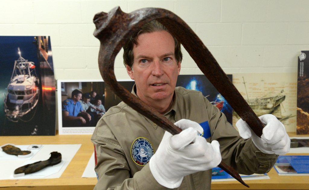 John Geiger, president of the Royal Canadian Geographical Society, holds an iron fitting identified as a davit from a Royal Navy ship. The artifact is considered the key piece of evidence that led to the discovery of a ship believed to be one of two fabled British explorer ships from the Franklin Expedition. The Associated Press / The Canadian Press, Sean Kilpatrick