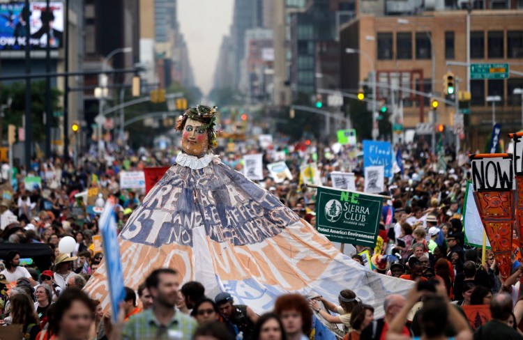 Tens of thousands of people fill the street during the People's Climate March Sunday in New York to urge policymakers to take quick action. The Associated Press