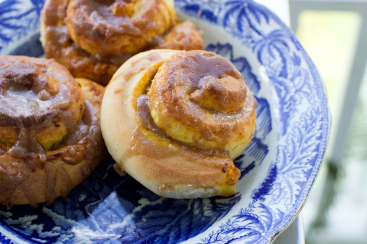 Salted caramel pumpkin buns combine two classics, pumpkin pie and a cinnamon bun, which is topped with a homemade caramel sauce.