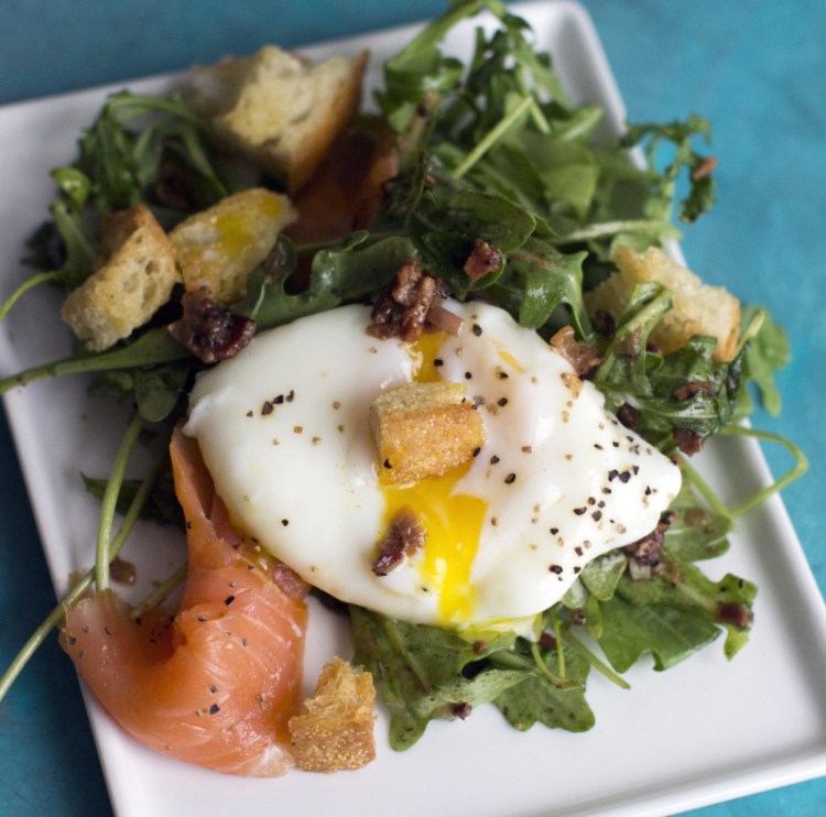 Lyonnais style salad with smoked salmon. The poached egg not only makes the salad quite substantial, but thanks to the luxurious way the yolk coats the greens once its been broken it also acts as an extra sauce 