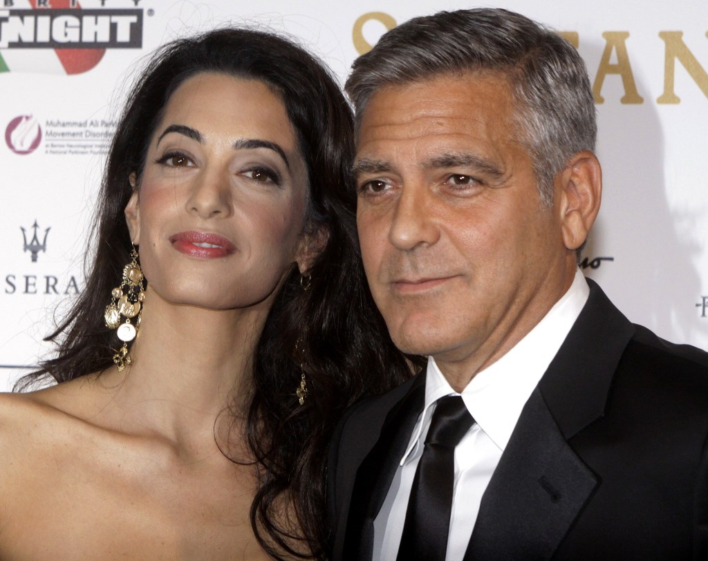 George Clooney and his fiancee Amal Alamuddin. The Associated Press