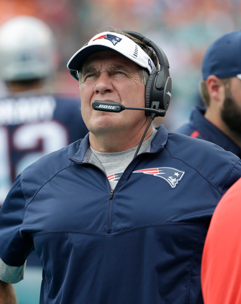 Patriots Coach Bill Belichick looks up during the first half Sunday's game. The Associated Press