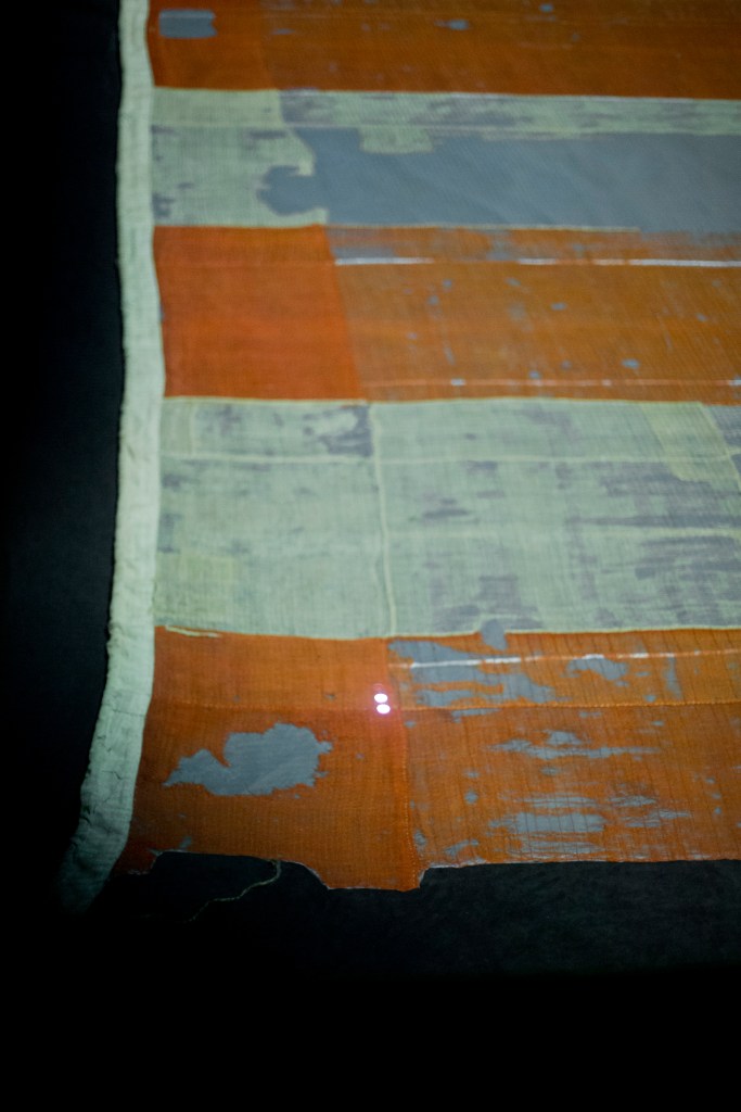 The Smithsonian's National Museum of American History exhibit of the flag that inspired the national anthem '"Star-Spangled Banner"' shows portions of the flag that are missing fragments. The Associated Press