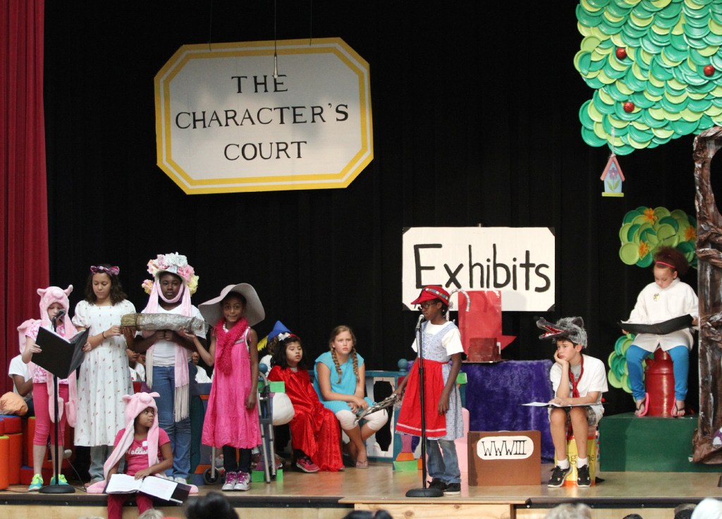 Third-graders fill the stage during a performance of "The Trial of the Big Bad Wolf" at Clinton Elementary School in Columbus, Ohio, for the final part part of a five-week summer reading program to help failing third-graders improve their skills. The Associated Press