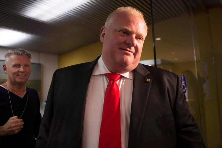 Toronto Mayor Rob Ford leaves his office at city hall in this  July 9, 2014, photo. The Associated Press / The Canadian Press,