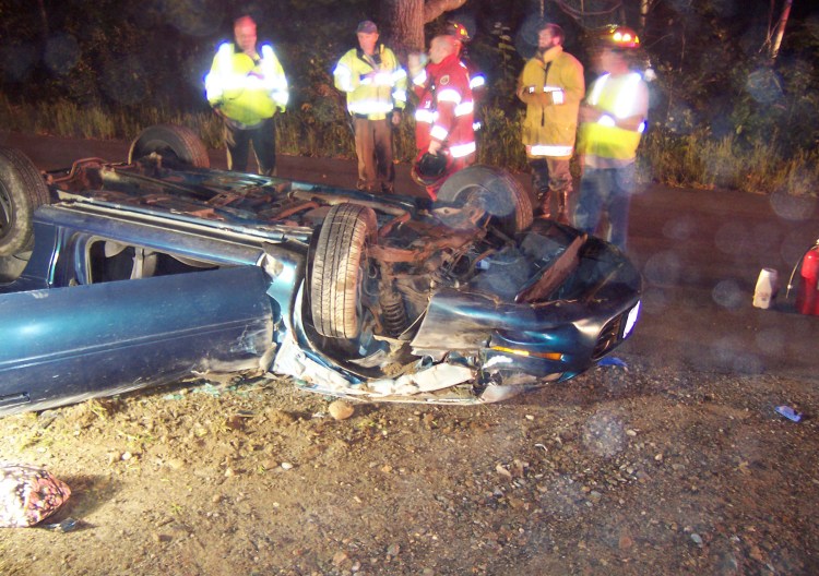 Emergency personnel work at the scene of the rollover in Boothbay Harbor early Tuesday morning. Courtesy Lincoln County Sheriff's Office