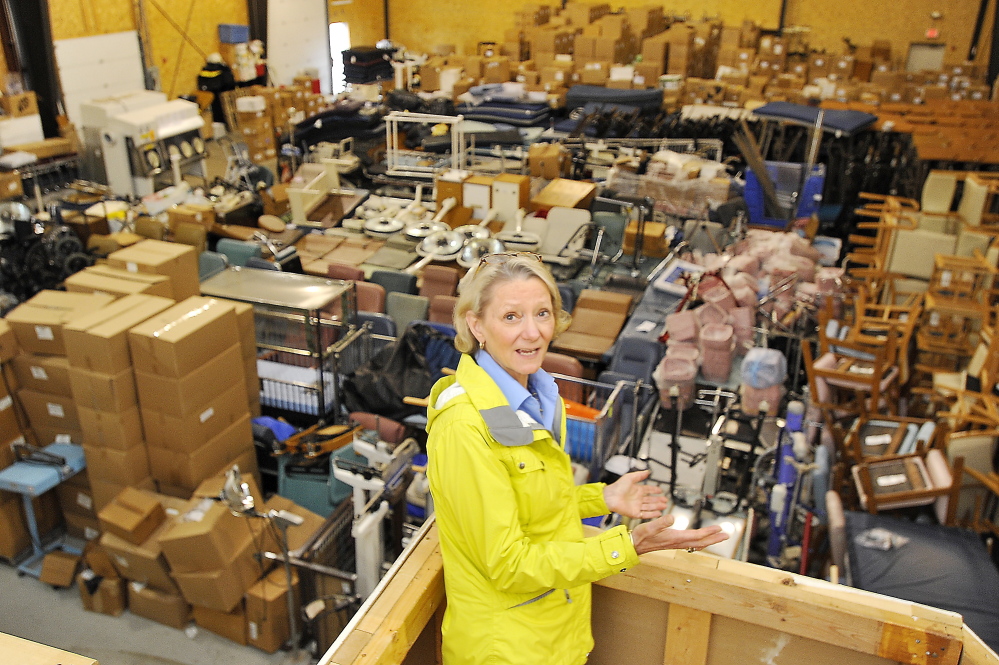 Elizabeth McLellan, founder of Partners for World Health, stands inside a Scarborough warehouse jam-packed with medical equipment bound for countries such as Uganda and Libya.