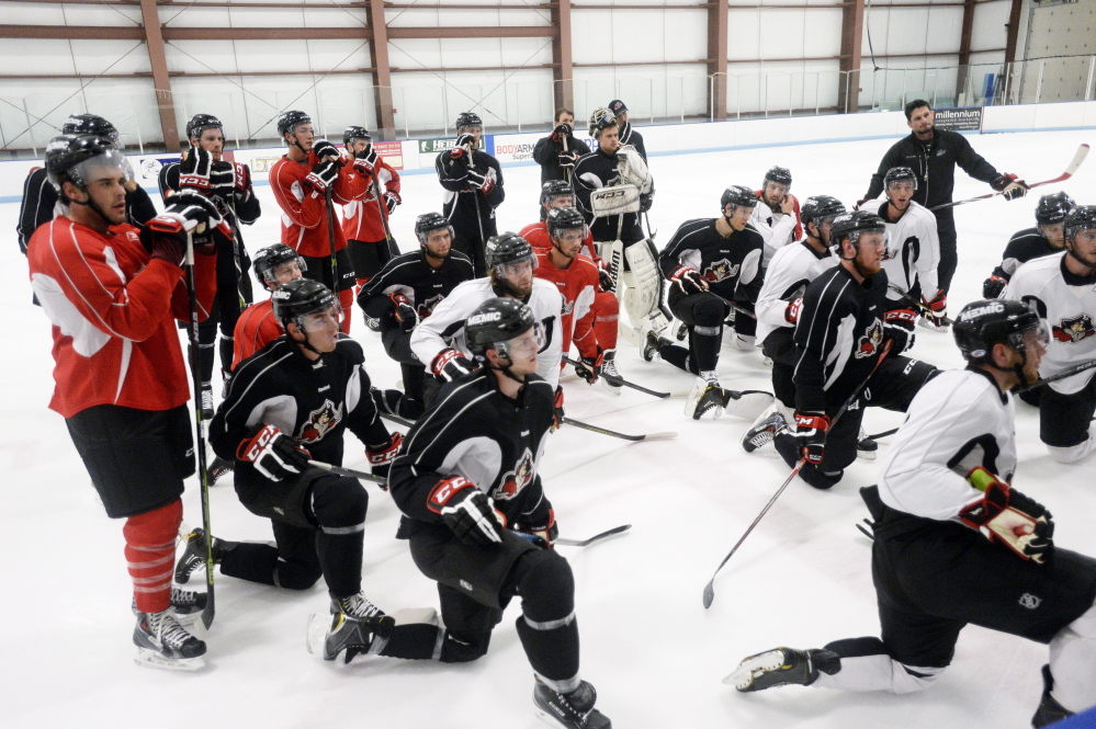 SACO, ME - SEPTEMBER 29: Portland Pirates players listen to their coach during the  first practice of the season Tuesday, September 30, 2014. (Photo by Shawn Patrick Ouellette/Staff Photographer)