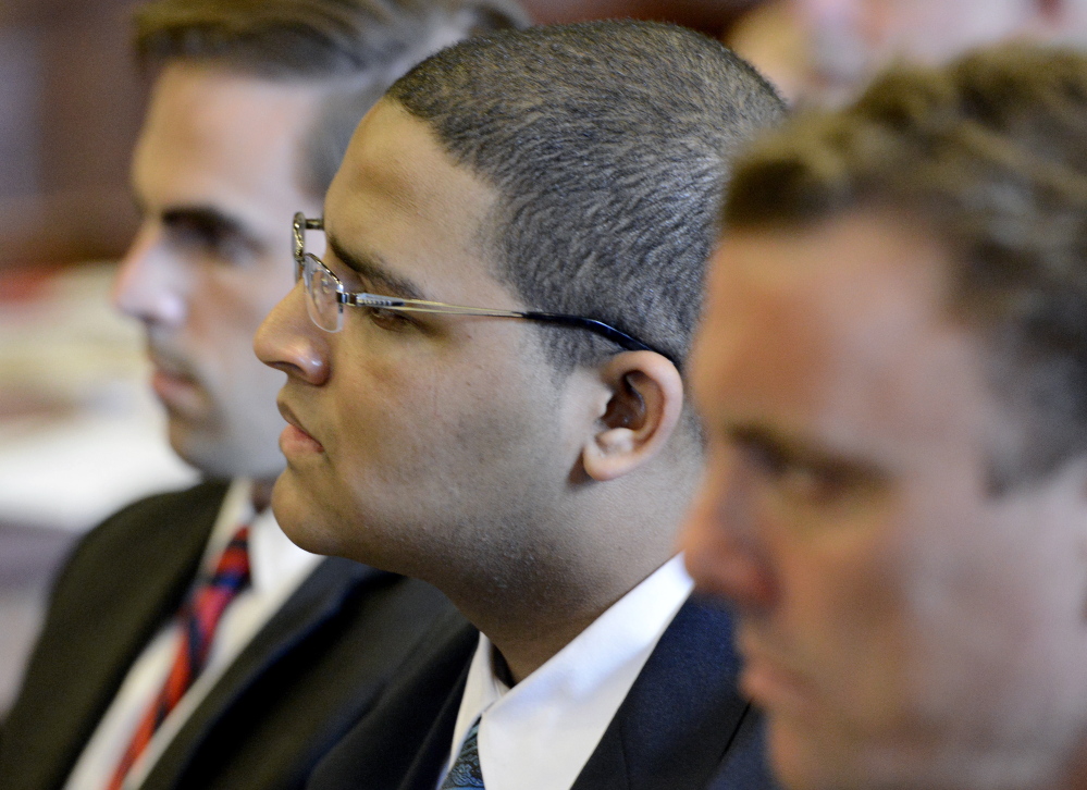 Anthony Pratt Jr. is flanked by his attorneys Dylan Boyd, left, and Peter Cyr on Monday at the Cumberland County Courthouse in Portland. Pratt’s murder trial continued Wednesday.