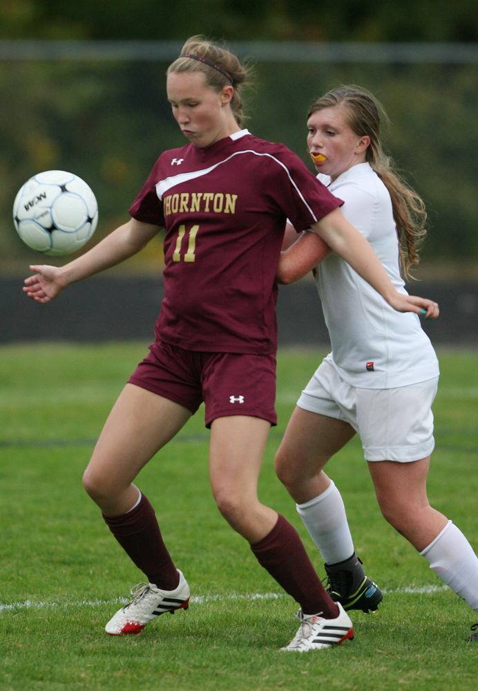 Skye Murray of Thornton Academy, left, blocks Cheverus’ Willa Tarasevich in the second half Wednesday at Portland. Thornton Academy won its third straight and improved to 7-1 with a 6-0 win.
