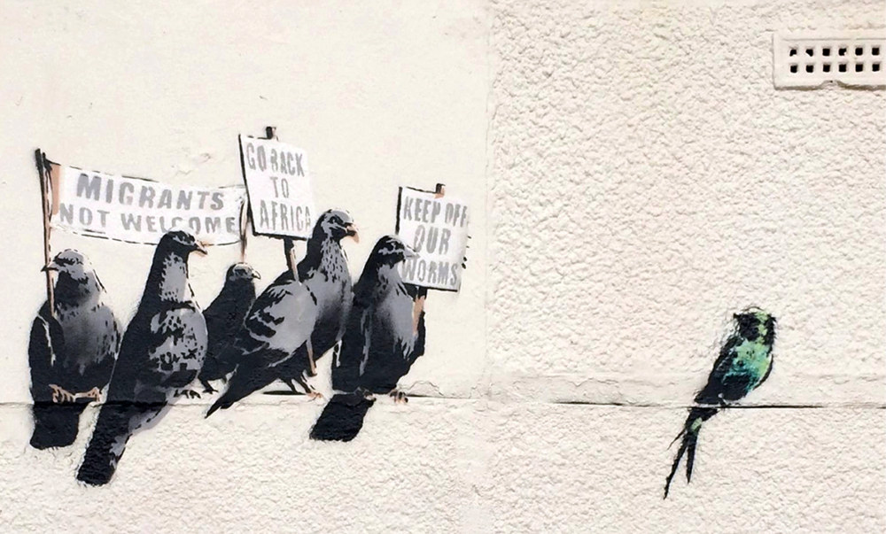 An image released Thursday by banksy.co.uk shows a mural by famed graffiti artist Banksy before authorities had it chemically removed from a wall because of complaints.
