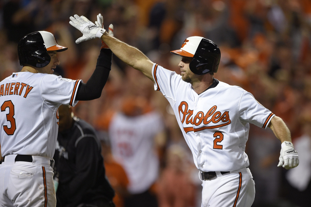 The Associated Press
Baltimore Orioles’ J.J. Hardy is met at the plate by Ryan Flaherty after his solo home run in the seventh inning against the Detroit Tigers on Thursday in Baltimore.