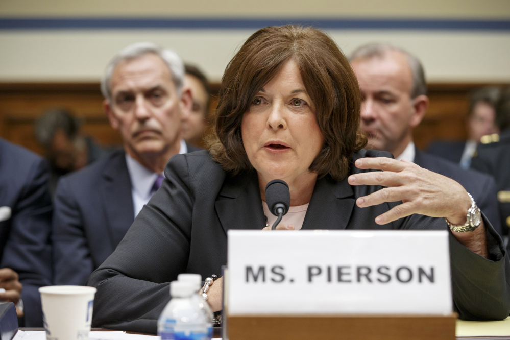 Julia Pierson testifies on Capitol Hill on Tuesday, one day before she resigned as Secret Service director because of a recent White House security breach.
