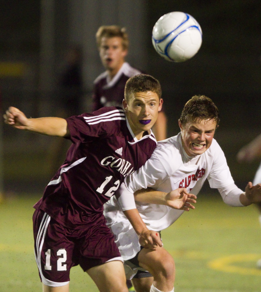 Thomas Brent of Gorham, left, and Josh Morrissey of Scarborough compete for a loose ball Thursday night during their SMAA boys’ soccer game at Scarborough High. Each team remained undefeated with a 1-1 tie.