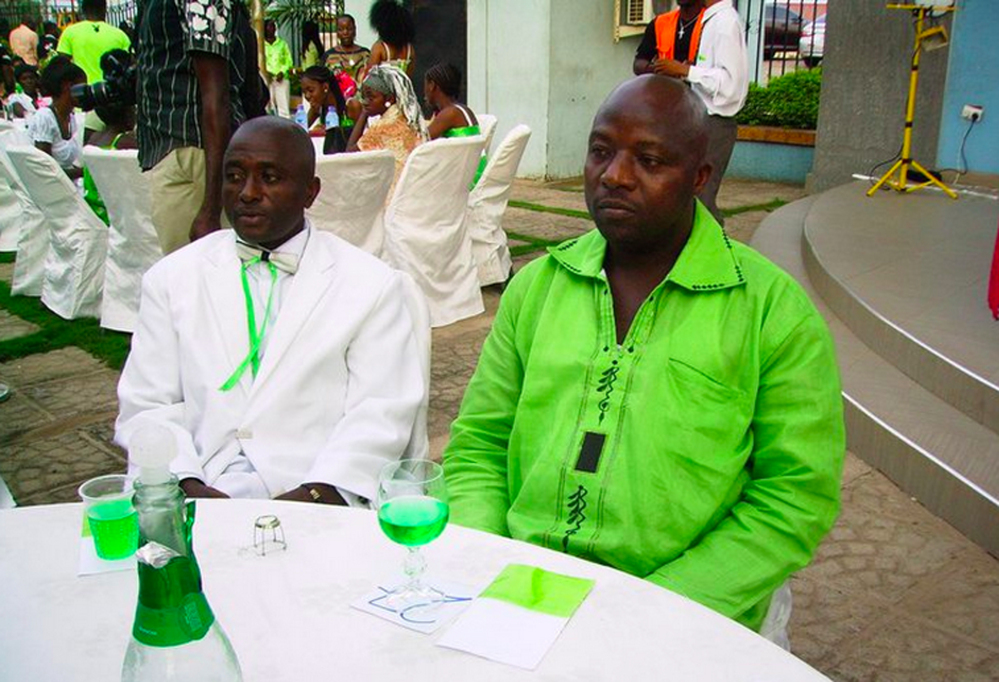 This 2011 photo provided by Wilmot Chayee shows Thomas Eric Duncan, right, with friend Wilmot Chayee at a wedding in Ghana.  Duncan, who became the first patient diagnosed in the U.S with Ebola, has been kept in isolation at a hospital since Sunday, Sept. 28, 2014. He was listed in serious but stable condition. (AP Photo/Wilmot Chayee)