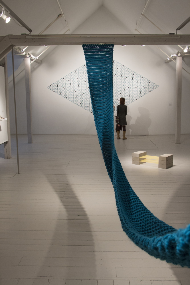 “Transatlantic (the weight of water),” hanging; and “Lyre,” on floor at right, by Stephanie Cardon.
