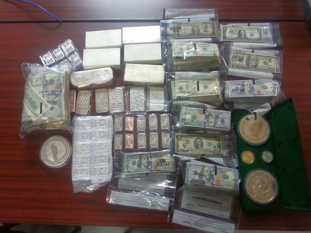 Shown is cash seized by authorities Thursday as part of an investigation into a theft ring.