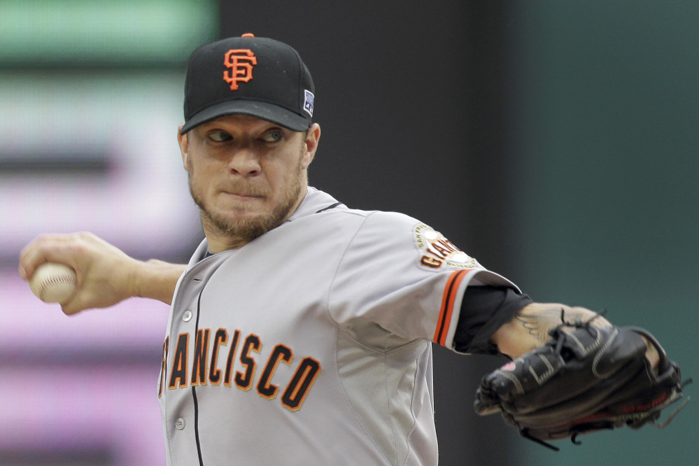 San Francisco Giants starting pitcher Jake Peavy throws in the second inning of Game 1 of the NL Division Series game against the Washington Nationals on Friday in Washington.