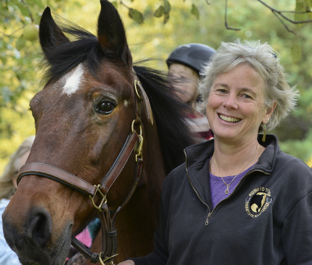 Sarah Bronson, a therapeutic horse riding instructor, has seen the Riding to the Top Therapeutic Riding Center in Windham grow so much since its founding in 1993.