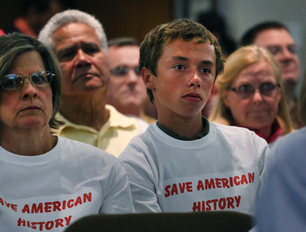 Members of the public attend Jefferson County School Board meeting, which heard testimony from members of the public weighing in on the school board’s controversial proposal to emphasize patriotism and downplay civil unrest in the teaching of U.S. history, in Golden, Colo., Thursday. The Associated Press