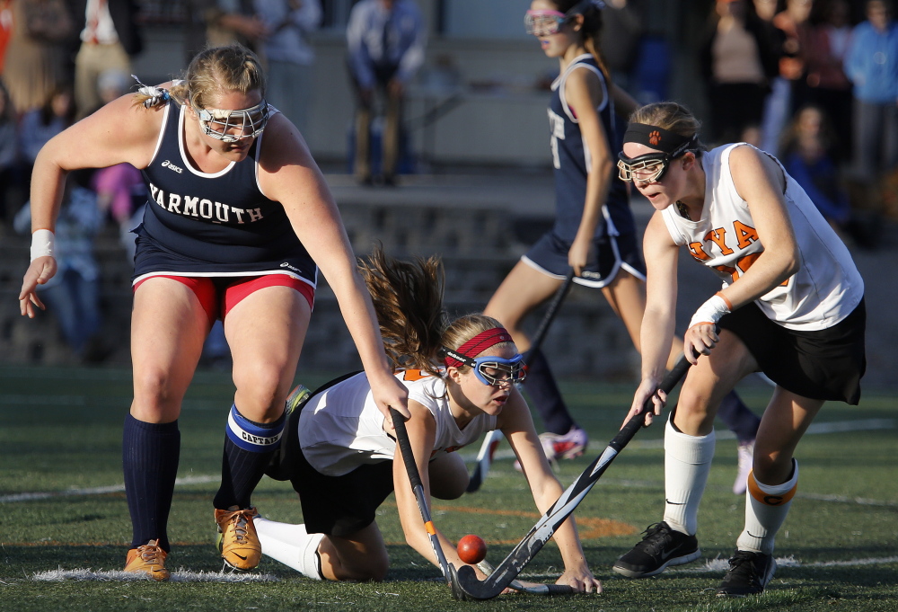 Meaghan Gorman of Yarmouth tries to knock the ball away from Marina Poole, right, of North Yarmouth Academy during Friday’s game at NYA. North Yarmouth handed Yarmouth its first loss, 2-1 in overtime.