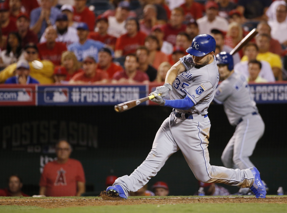 Kansas City’ Eric Hosmer hits a game-winning two-run home run against the Los Angeles Angels in the 11th inning of Game 2 of the AL Division Series on Friday night in Anaheim, Calif.