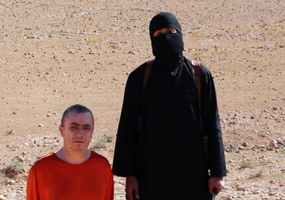 This undated image shows a frame from a video released Friday, Oct. 3, 2014, by Islamic State militants that purports to show the killing of journalist Alan Henning by the militant group.