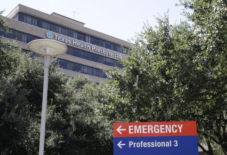 A sign points to the emergency room at Texas Health Presbyterian Hospital  where Thomas Eric Duncan, the Ebola patient who traveled from Liberia to Dallas, was being treated Saturday.