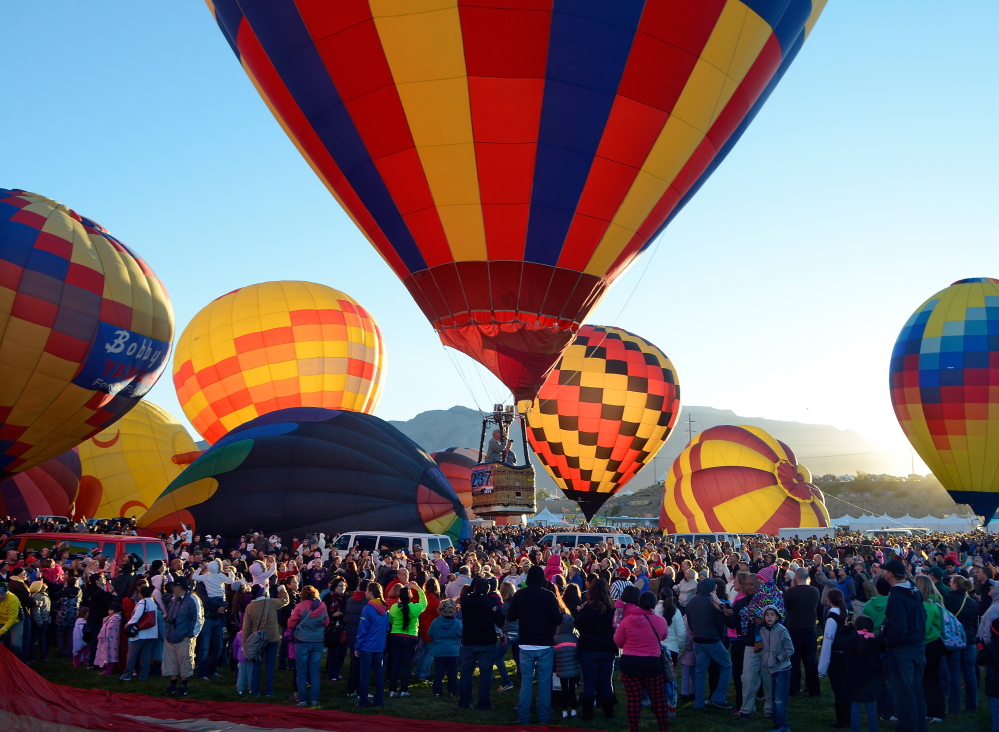 A balloon lifts off  over the crowd Saturday morning during the annual Albuquerque International Balloon Fiesta in Albuquerque, N.M. Organizers have equipped all 550 pilots with tablet computers capable of running a mapping application that will enable them to steer clear of the many restricted areas and prohibited zones.
The Associated Press